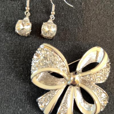 Pierced Earrings. Tied With A Nolan Miller Bow. 