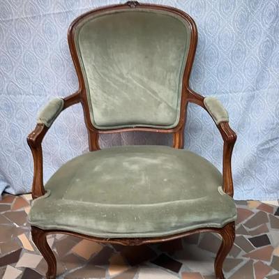 French Louis XV-style upholstered armchair. 