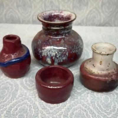 Collection of small ceramic vases and a bowl with various glazes