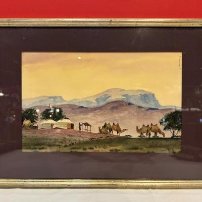 Framed original Mongolian watercolor depicting a nomadic scene with camels, illegible signature in top left margin, 19 1/2” x 14 1/2”