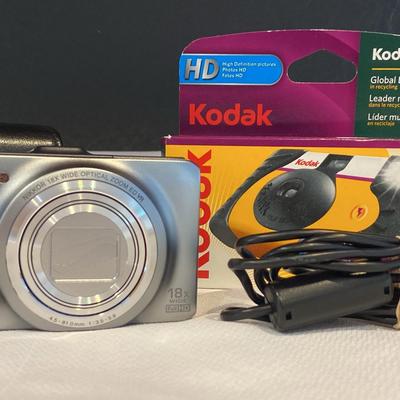 Nikon Coolpix And Kodak Disposable Cameras