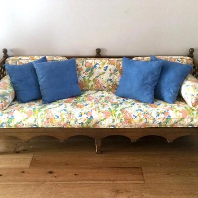 Floral Cushioned Sofa With Plaited Wooden Frame And Blue Pillows