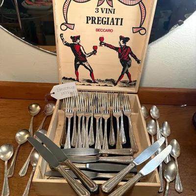 Flatware in a pregiati beccaro" wood wine box