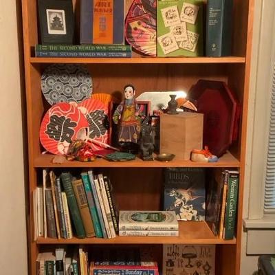Wood bookcase with books trinkets
