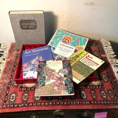 Persian table carpet assorted books