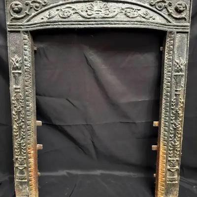 Antique Cast Iron Fireplace Surround with Ornate Victorian-Era Detailing