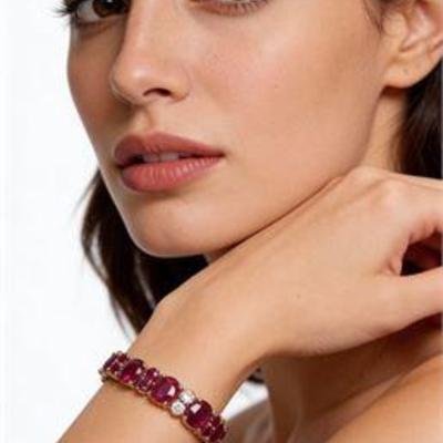 Lot 002  
26.19 cttw Mozambique Ruby 1.1 cttw Diamond 18K Yellow Gold Bracelet