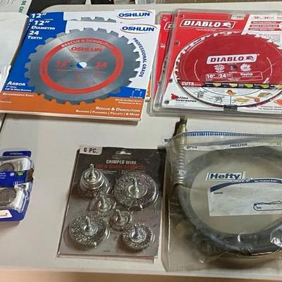 New In Box 14”-10” Saw Blades, 2 Hydrolic Hoses, Dremel Tool Wheels