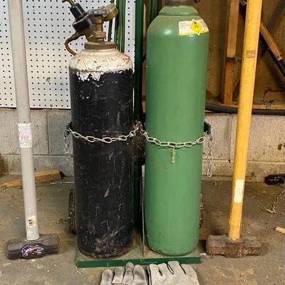 Green Oxygen Tank & Black Acetylene Tank On Cart. Comes With 2 Mallets & Welding Gloves