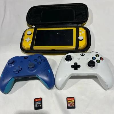 Nintendo Switch Lite Yellow With 2 Games And Traveling Case & 2 Xbox Controllers
