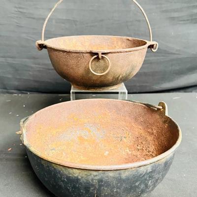 rusty antique cast iron cauldrons