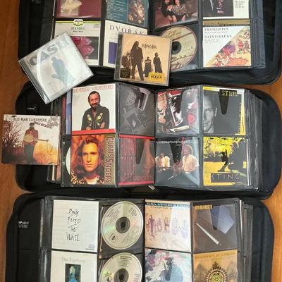Different Styles Of Music CDs In Cases