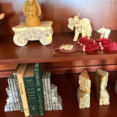 Mixed Decorative Collectibles Shelf Lot – Figurines, Stone Bookends, Pottery, Books, and Décor