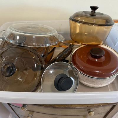 Large Lot of Amber Glass Cookware Including Covered Sauce Pans and Casserole Dishes