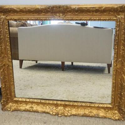 Sale Photo Thumbnail #85: 1085	MIRROR IN ORNATE GILT FRAME, APPROXIMATELY 34 IN X 40 IN
