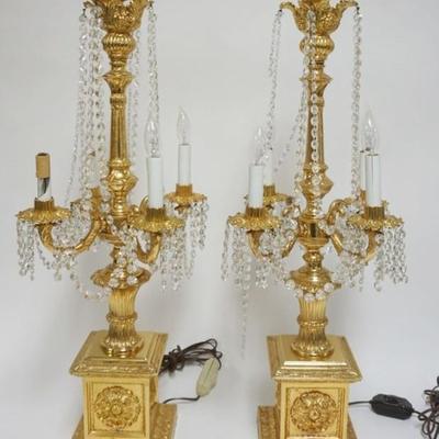 Sale Photo Thumbnail #33: 1033	METAL GILT FINSHED CANDELABRAS, EACH APPROXIMATELY 33  IN H, SOME LOSS TO PRISMS
