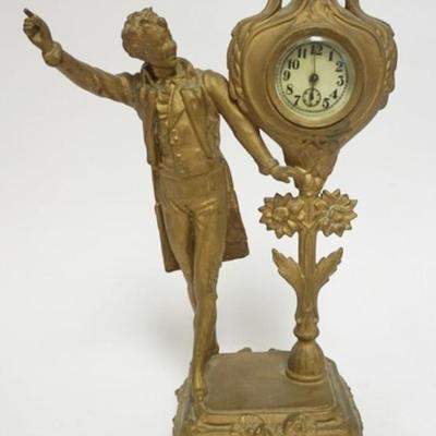 Sale Photo Thumbnail #42: 1042	ANTIQUE CAST METAL FIGURAL CLOCK, APPROXIMATELY 13 1/2 IN H
