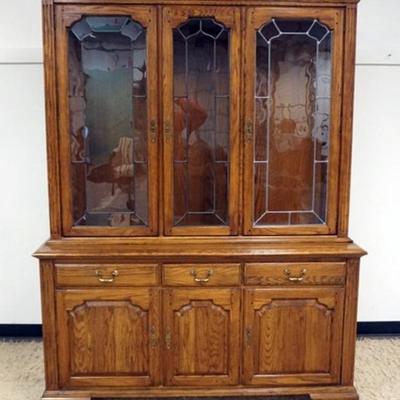 Sale Photo Thumbnail #199: 1200	ETHAN ALLEN OAK BREAKFRONT WITH LEADED GLASS DOORS AND INTERIOR LIGHTS, APPROXIMATELY 62 IN X 20 IN X82 IN H
