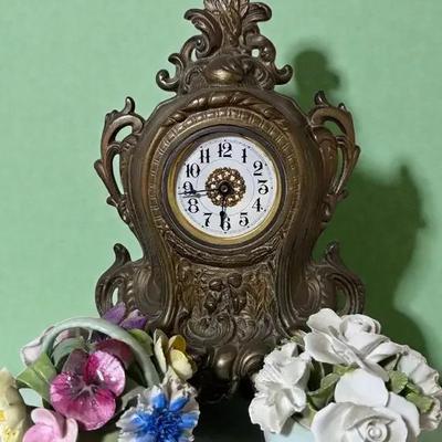 Antique cast metal mantle clock