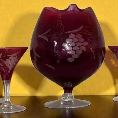 Cranberry cut to clear bohemian champagne glasses with grape pattern
