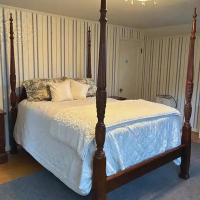 A rice carved" full size 4 poster bed