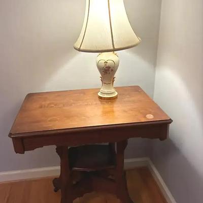 Eastlake side table and porcelain lamp