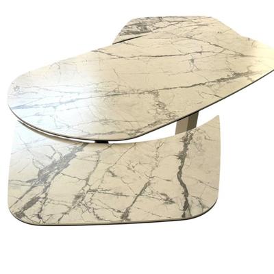 Calligaris Orbital Modern Extendable Dining Table with White Marble Ceramic Top. Dimensions closed: 64 in (L) x 39 in (W) x 29 5/8 in...