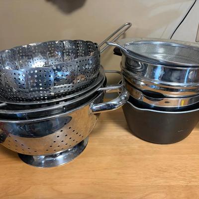 Lot of saucepans and strainers
