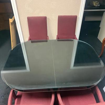 556: 1980s Glass-Top Dining Table w/ Leaf & 4 Burgundy Captain’s Chairs