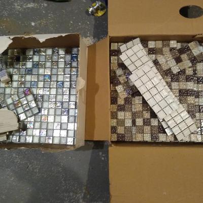 Two partial boxes of mosaic tile
