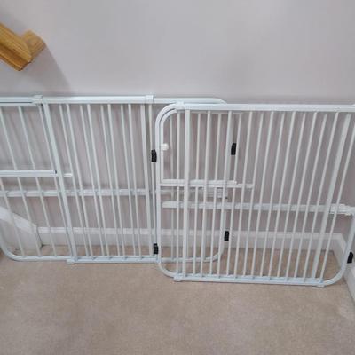 Two metal pet gates