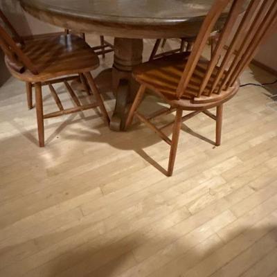 Windsor style chair and pedestal dining table