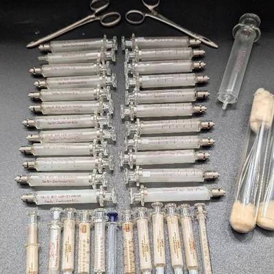 Glass Syringes, Metal Forceps, and Clamps