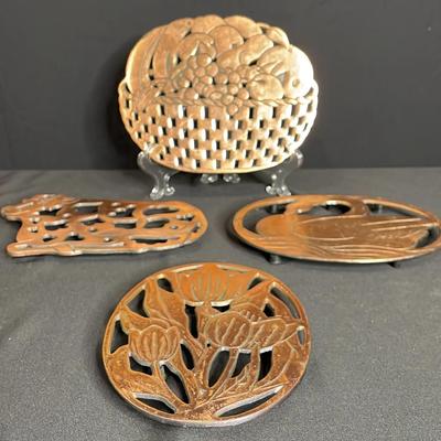 Metal And Copper Tone Trivets
