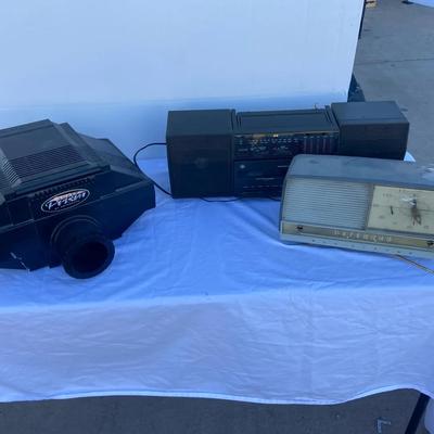 Super Prism Projector, Clock Radio And Cassette Recorder Player