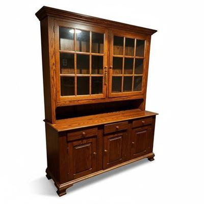 Lot 021   
Amish Craftsmanship Two-Piece, Solid Oak Stepback Hutch