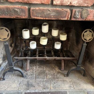 Decorative pair of andirons; between, a well-loved fire-log rack; atop the rack, to add coziness thru the warmer months, a decorative...