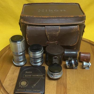 Vintage Nikon rangefinder camera lenses, cases, and viewfinder