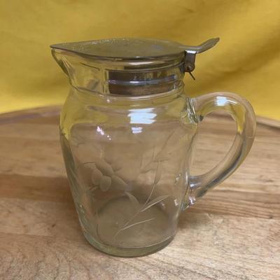 Antique etched glass syrup pitcher with a metal lid