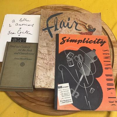 A collection of vintage Simplicity sewing book, Flair magazines, and literary works