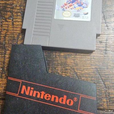 Nintendo Entertainment System (NES) game cartridge Blades of Steel

by Konami. 

