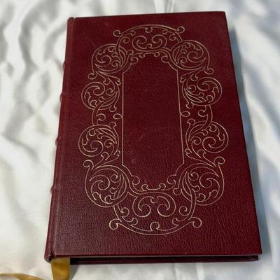 Decorative red leather-bound book with gilt tooling
