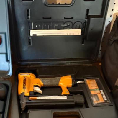 Bostitch pneumatic nail gun set, appears lightly used, includes hard carrying case and accessory box, likely suitable for finish or trim...