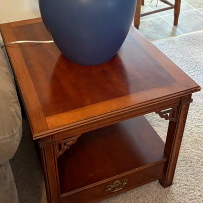 Wood end table with drawer and shelf, appears traditional accent furniture