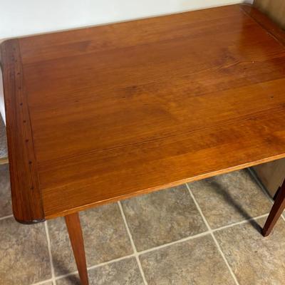 Close up wood table top likely oak with visible grain