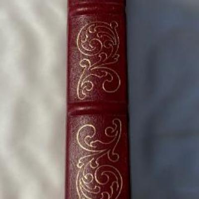 Decorative red leather-bound book with gilt tooling