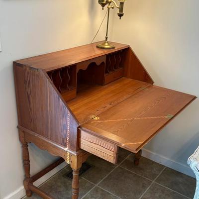 Vintage wooden drop-front secretary desk with cubbies, likely early-mid 20th century