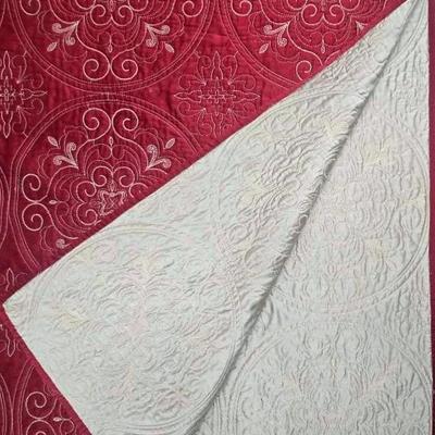 Burgundy and Tan Quilt with a Medallion Pattern