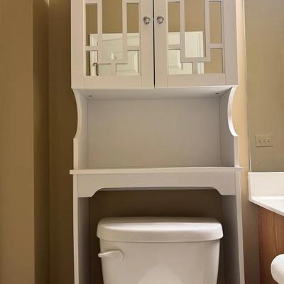 White Shelving Unit Over The Toilet 