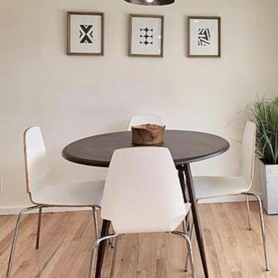 Sale Photo Thumbnail #82: Round mod black dining table (white chairs not avail)  
